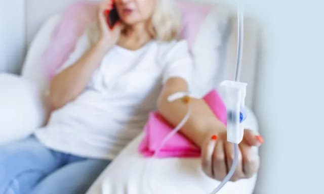 Professional performing intravenous vitamin infusion treatment